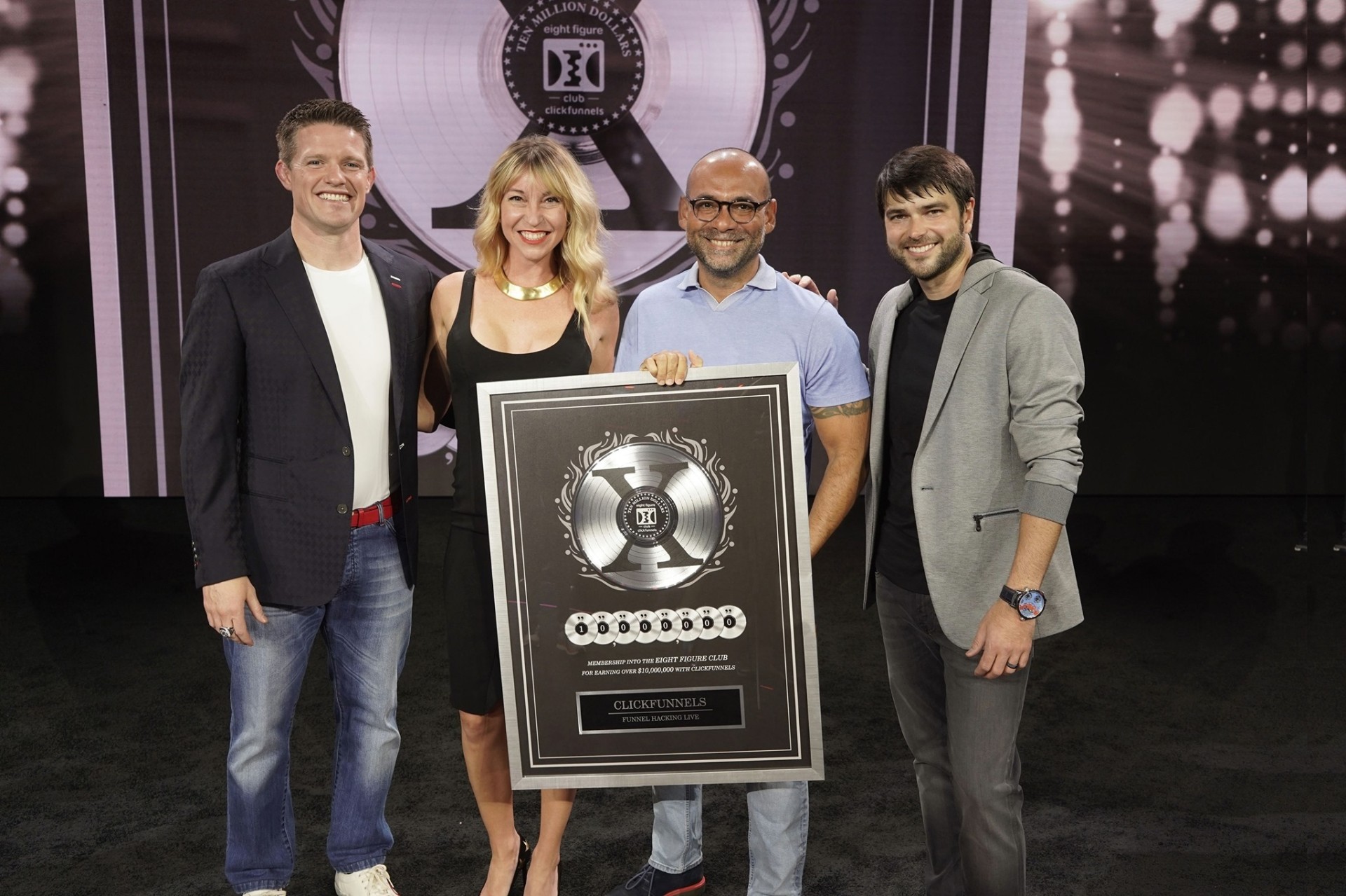 Rafa and Chelsea receiving the ClickFunnels Two Comma Club X award for earning over $10,000,000